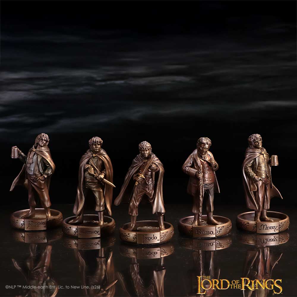 Hobbits of the Shire figurine set on a dark Lord of the Rings themed background
