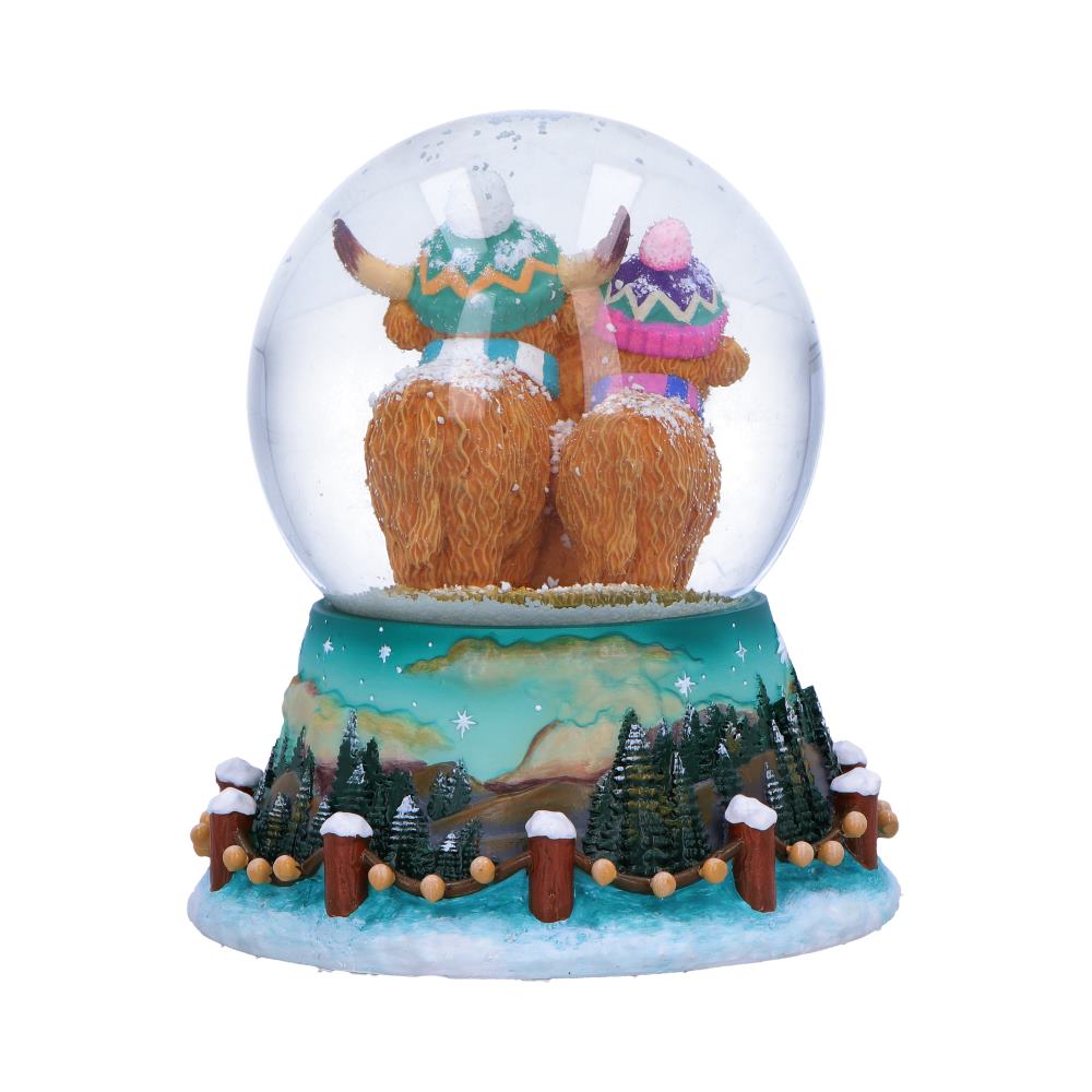Winter Highland Cow Family Snow Globe - Rear showing cow coats and winter scenery