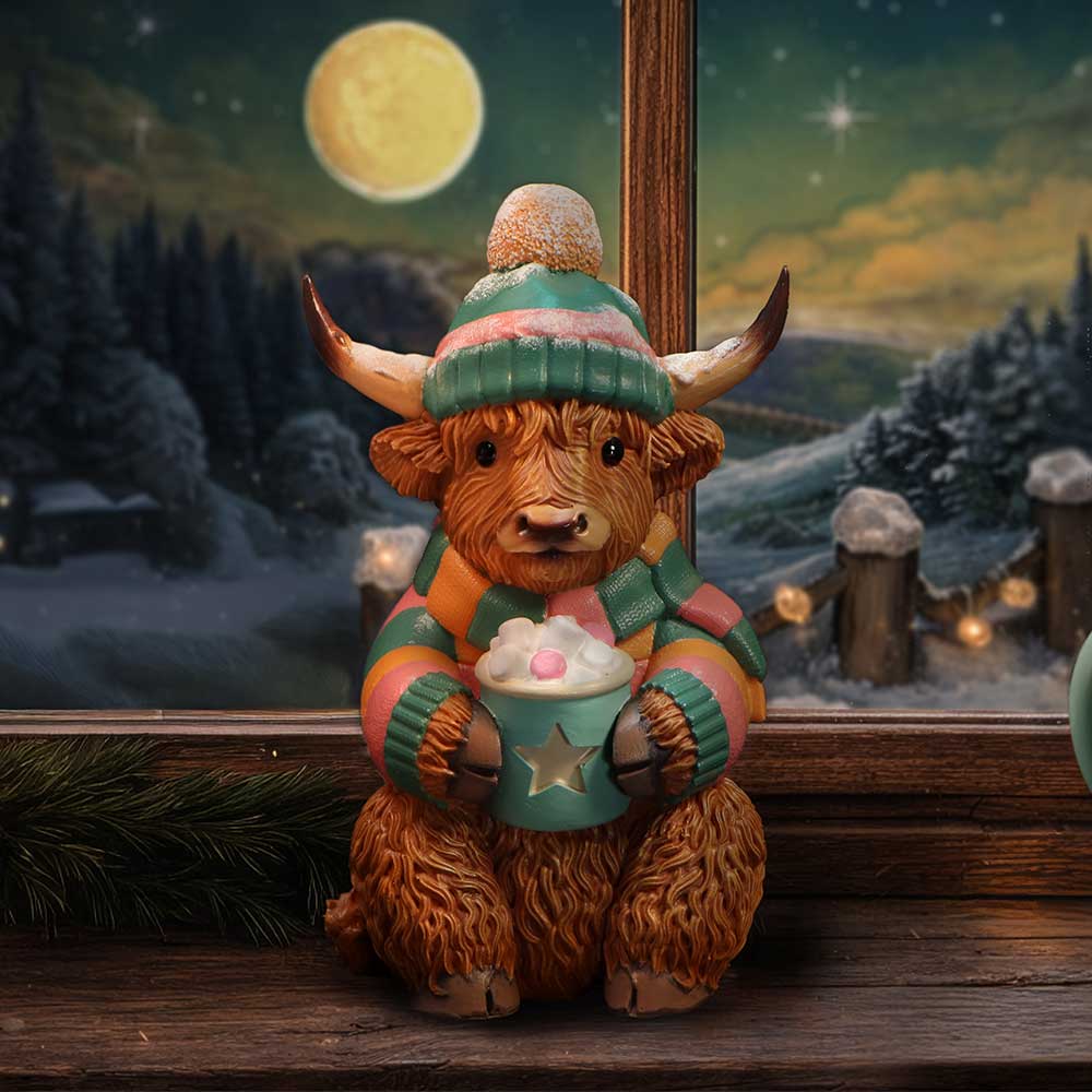 Winter Highland Cow Hot Cocoa Figurine - Cocoa cow in a styled winter display
