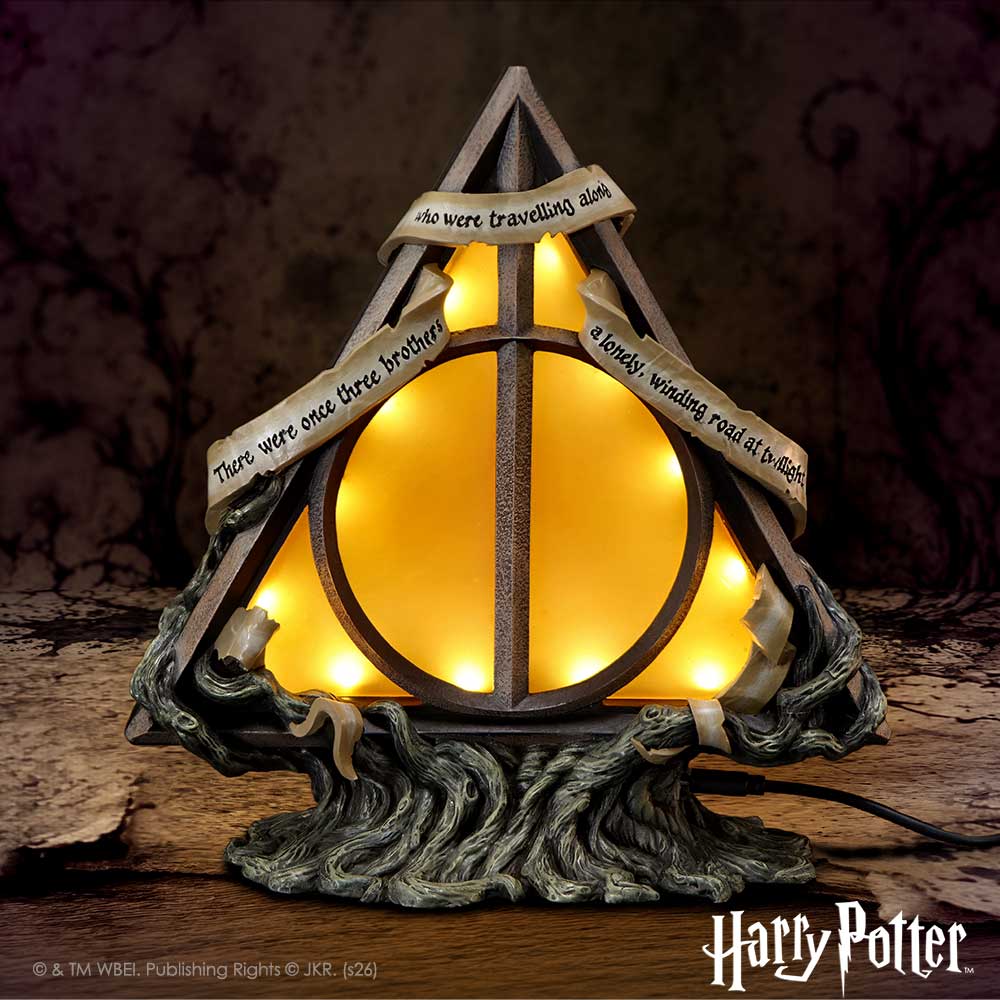 Harry Potter Deathly Hallows Lamp - Deathly Hallows lamp illuminated in a dark setting