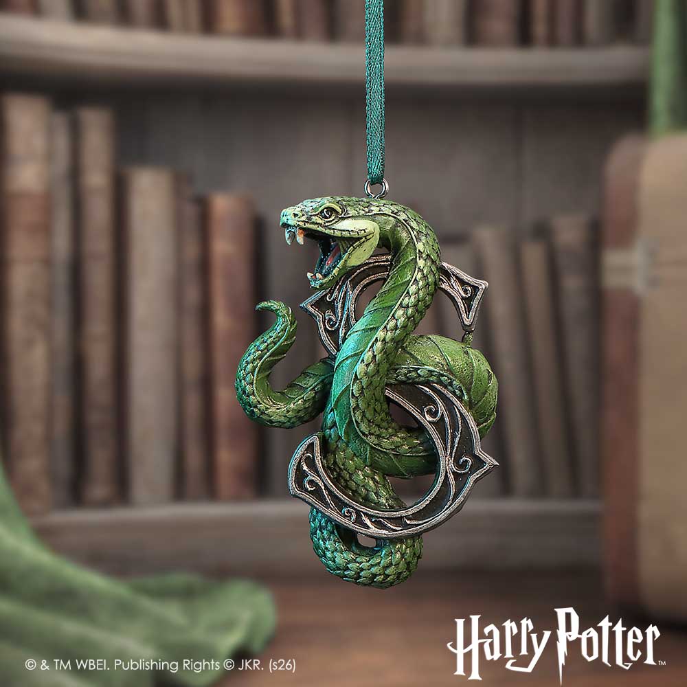 Harry Potter Slytherin Hanging Ornament - Green-ribbon serpent ornament displayed before bookshelves