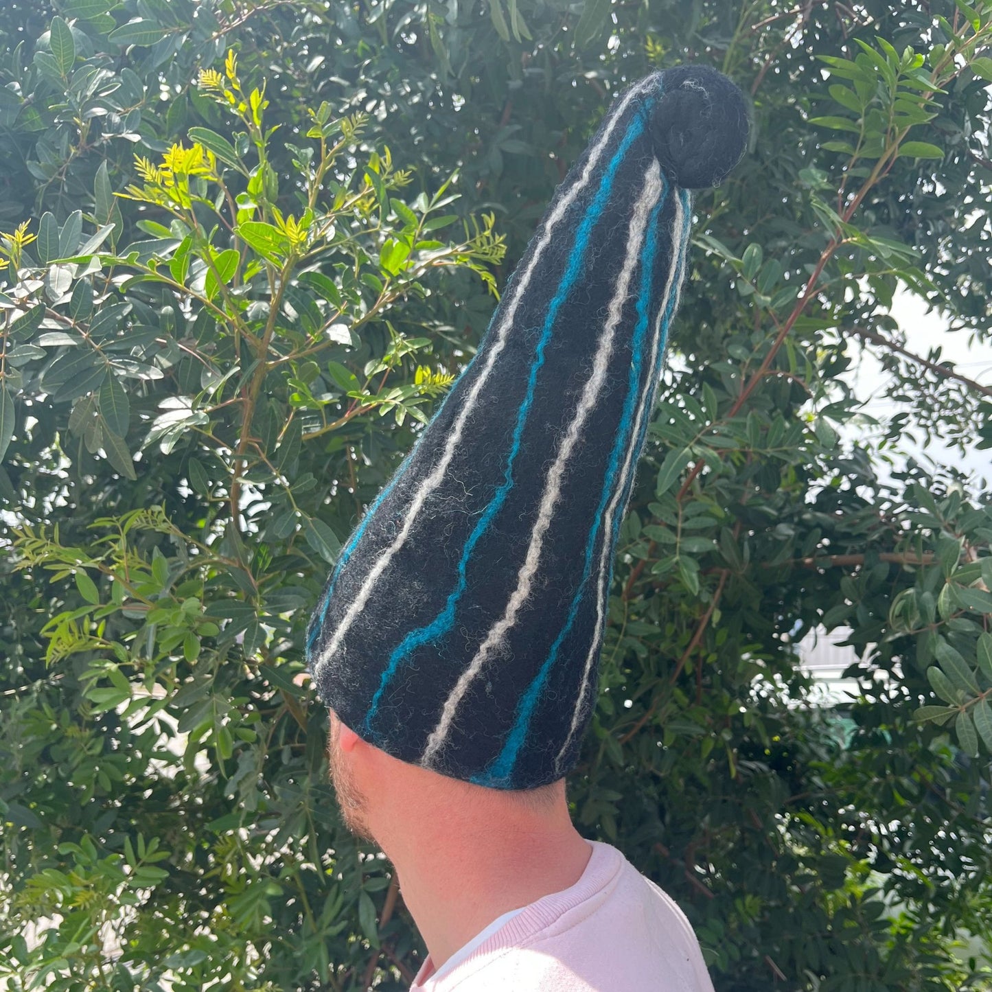 Felted Sauna Wizard Hat with black and blue streaks in felted wool
