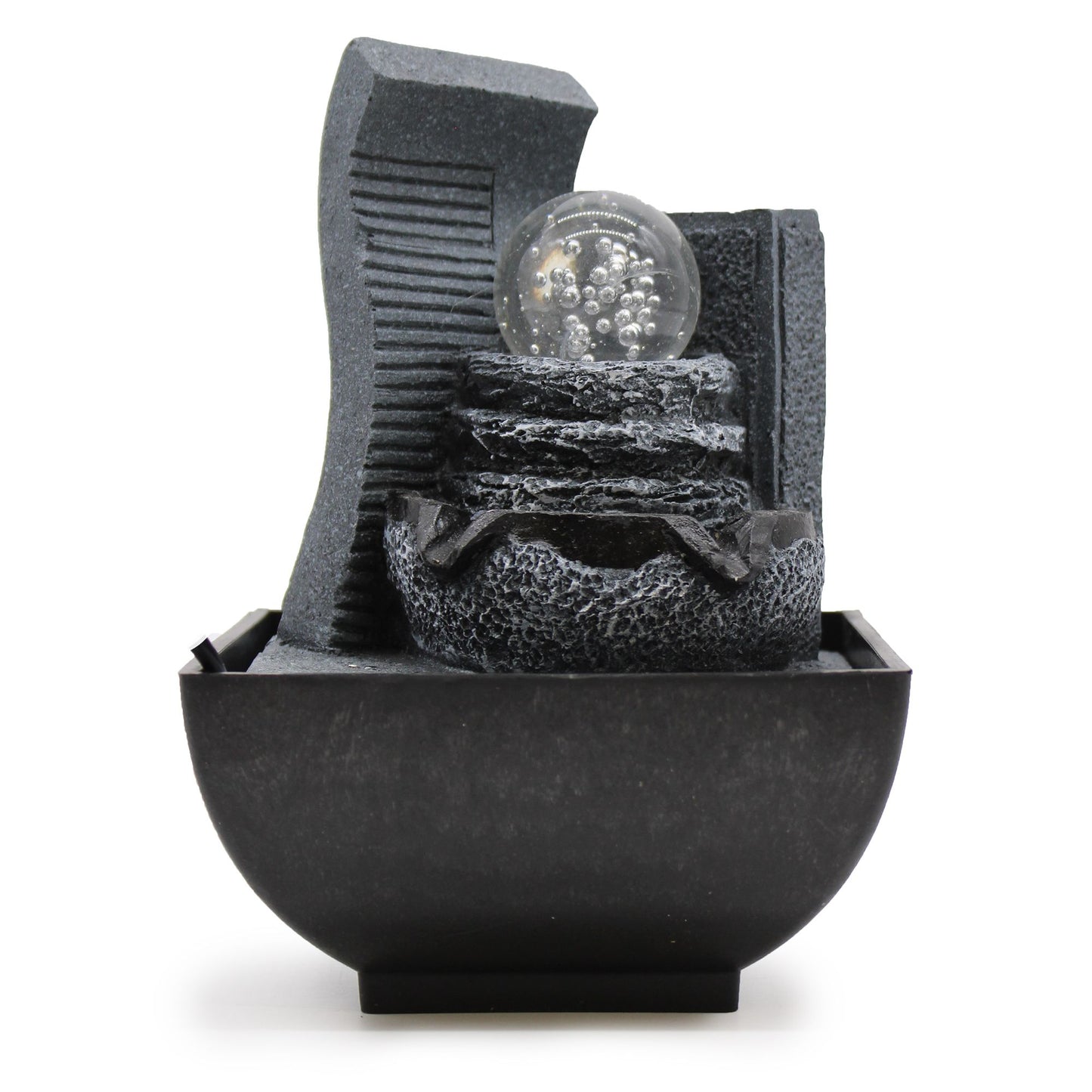 Cascading rock formation tabletop water feature with flowing water