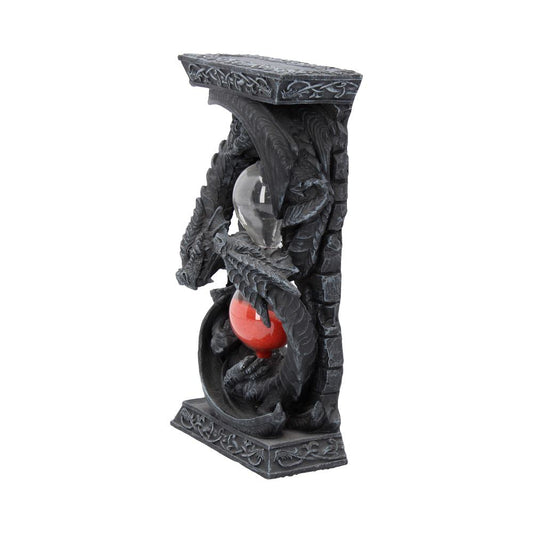 A double hourglass, encased in a dark gray dragon sculpture, sits on a base. The sand is clear and red.