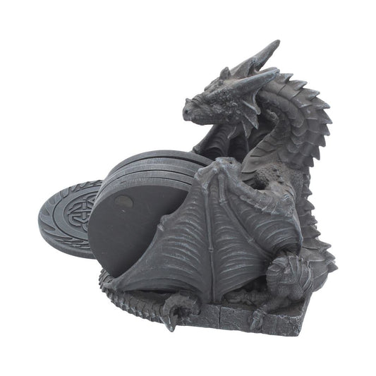 A dragon-shaped coaster holder, holding four coasters, sits on a white background.