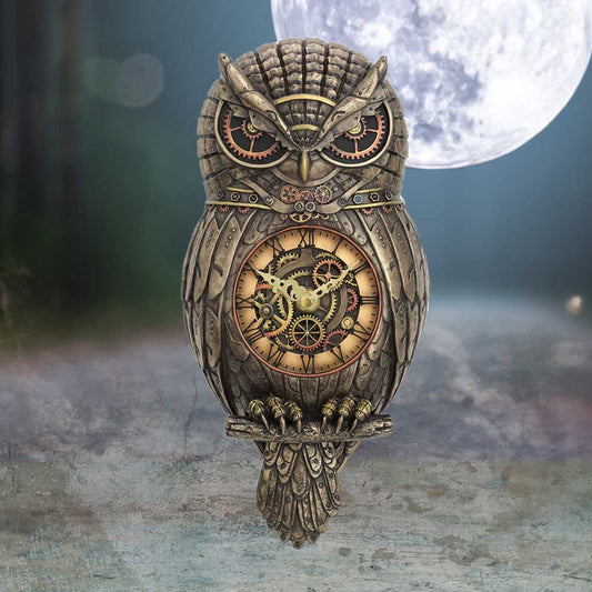 Bronze steampunk owl-shaped clock perches on a branch, housing exposed gears and a round clock face marked I to XII, set against a misty moonlit forest background.