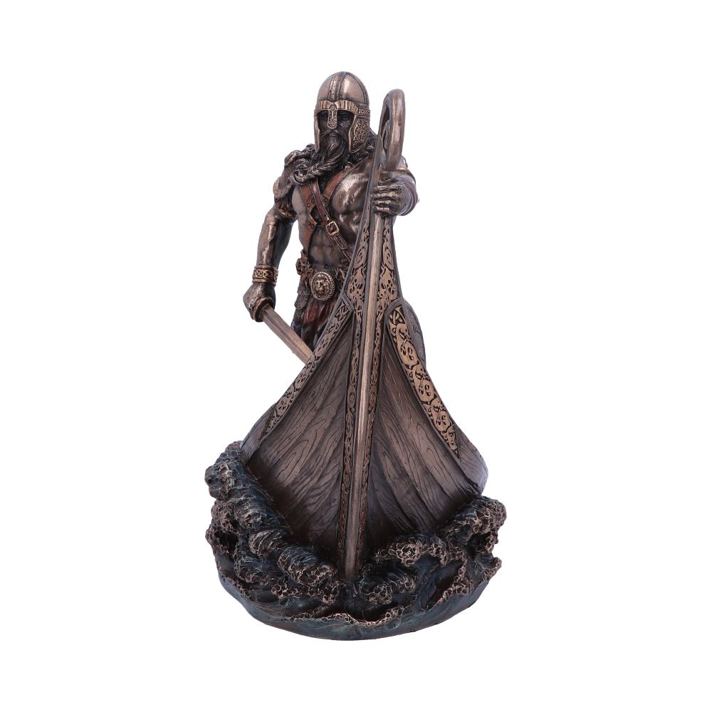 A warrior figurine stands on a Viking ship's prow, holding a sword and shield, amid swirling ocean waves, evoking a sense of ancient maritime conquest.