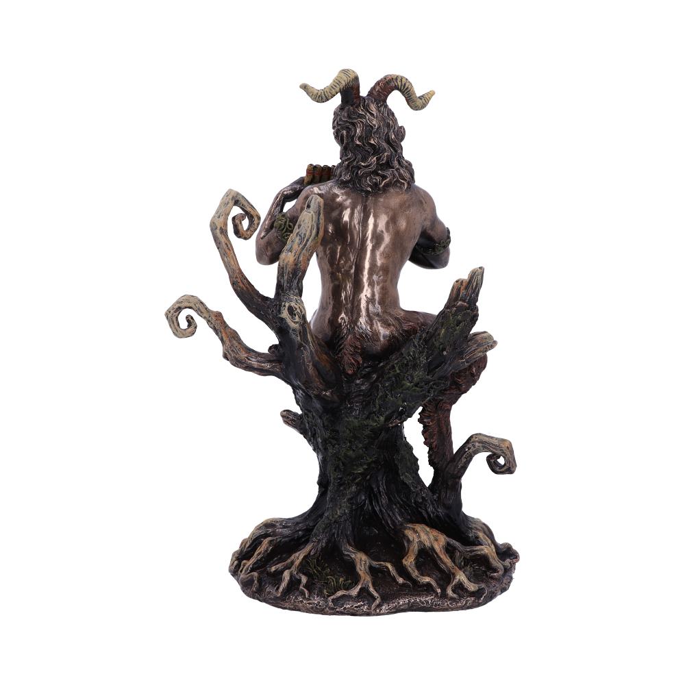 A horned figure sits playing a flute on a twisted tree stump. The figure's muscular back and curved horns are visible, framed by gnarled branches and roots.