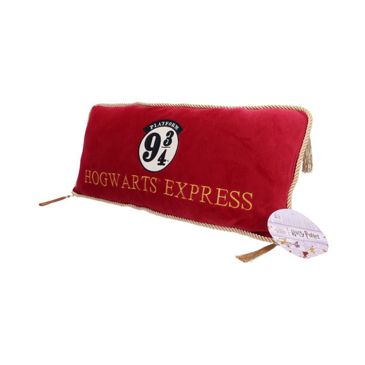 A red pillow displays the text "Hogwarts Express" and "Platform 9¾" in gold and black. It features gold tassels and an attached tag reading "Harry Potter."
