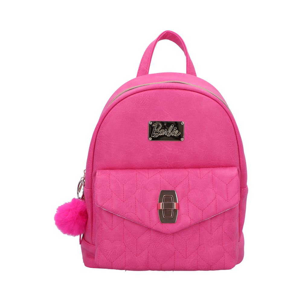 A pink Barbie backpack sits against a white background. The backpack features a quilted design, gold-colored hardware, and a small fur pom-pom. "Barbie" is displayed on a gold-colored plaque.