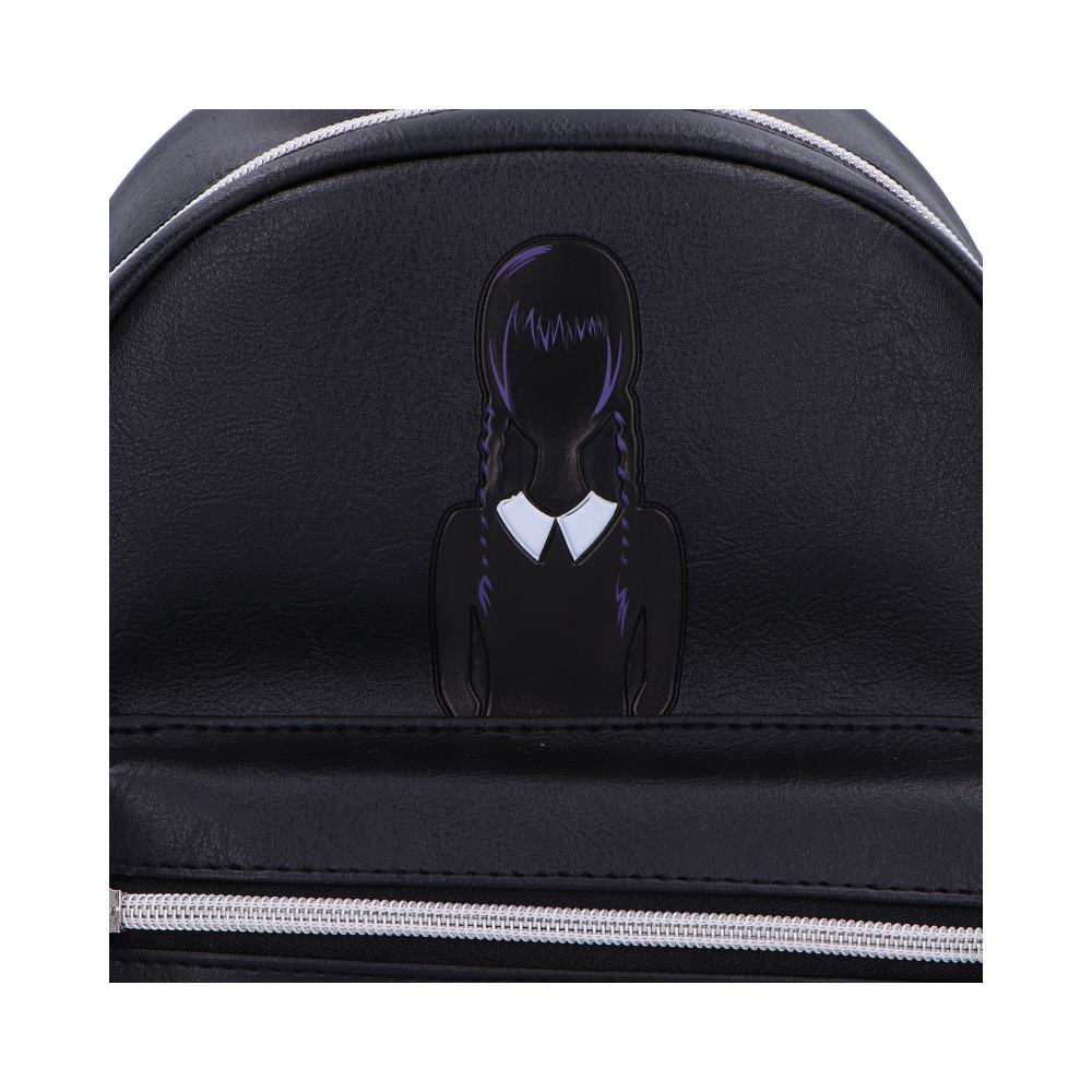 A black backpack features a purple-haired girl applique. The backpack is closed.