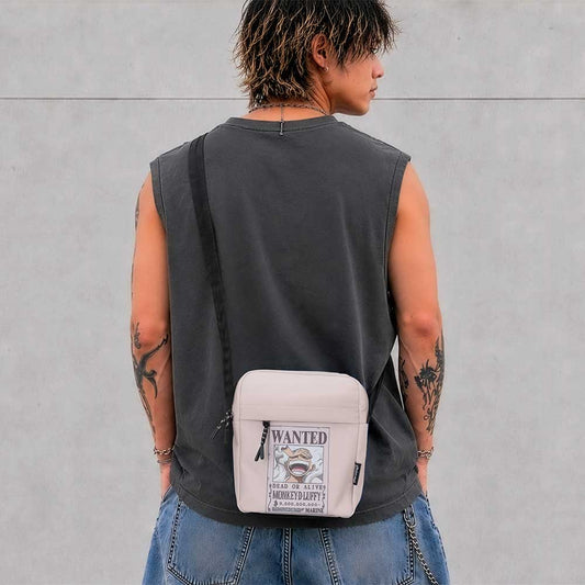One Piece Luffy Wanted Poster Crossbody Bag - Cream Luffy poster bag worn with a dark sleeveless top