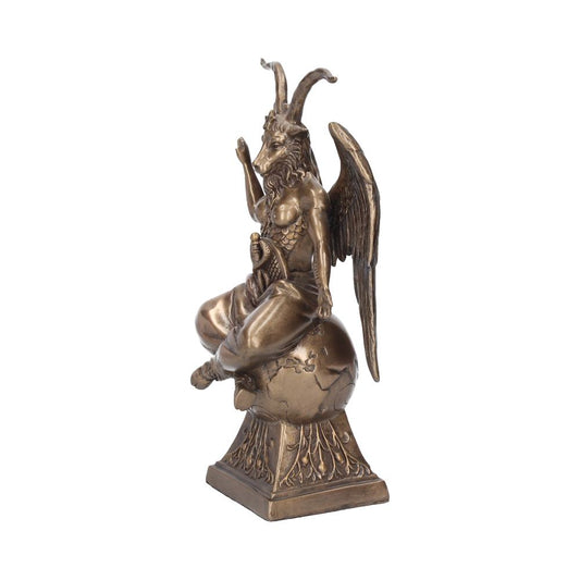 A bronze Baphomet statue sits cross-legged on a globe. The statue has ram horns, wings, and a sword in its right hand. It is displayed on a square base against a white background.