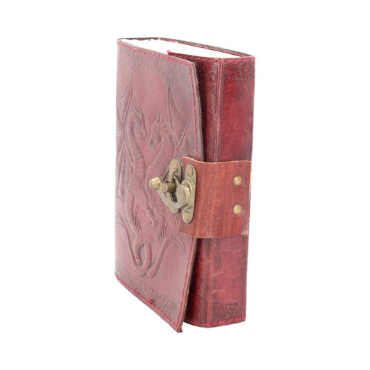 A burgundy leather journal, embossed with dragons, rests on a white background; it is closed and fastened with a brass clasp.