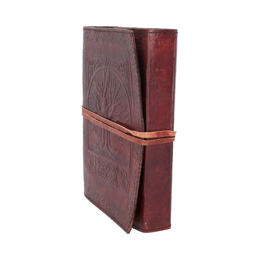 A brown leather-bound journal is closed and secured with a strap, featuring an embossed tree design, set against a plain white background.