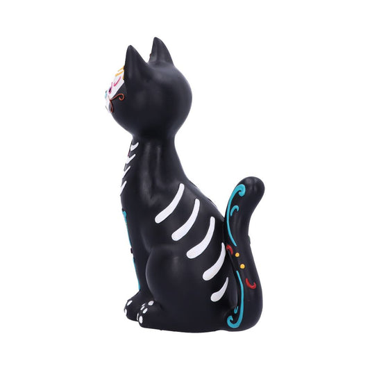 A black cat figurine sits upright, decorated with colorful patterns resembling skeleton bones. It features vibrant swirls on its tail and is set against a plain, white background.