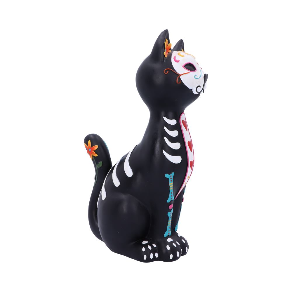 A black ceramic cat figurine sits upright, decorated with colorful Day of the Dead-style patterns including flowers, bones, and hearts, against a white background.