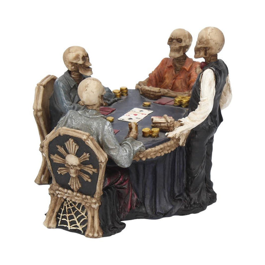 Four skeletons play poker around a black table with gold coins. Three are seated in bone-decorated chairs while one stands as if waiting his turn.