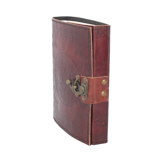 A brown leather journal stands upright with an embossed design and metal latch closure. It rests against a plain white background.