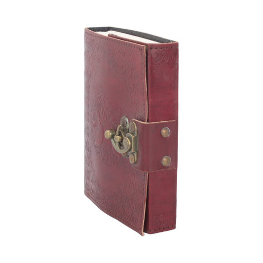A closed, red leather journal with an embossed tree design; secured by a decorative metal latch, it stands upright against a plain white background.