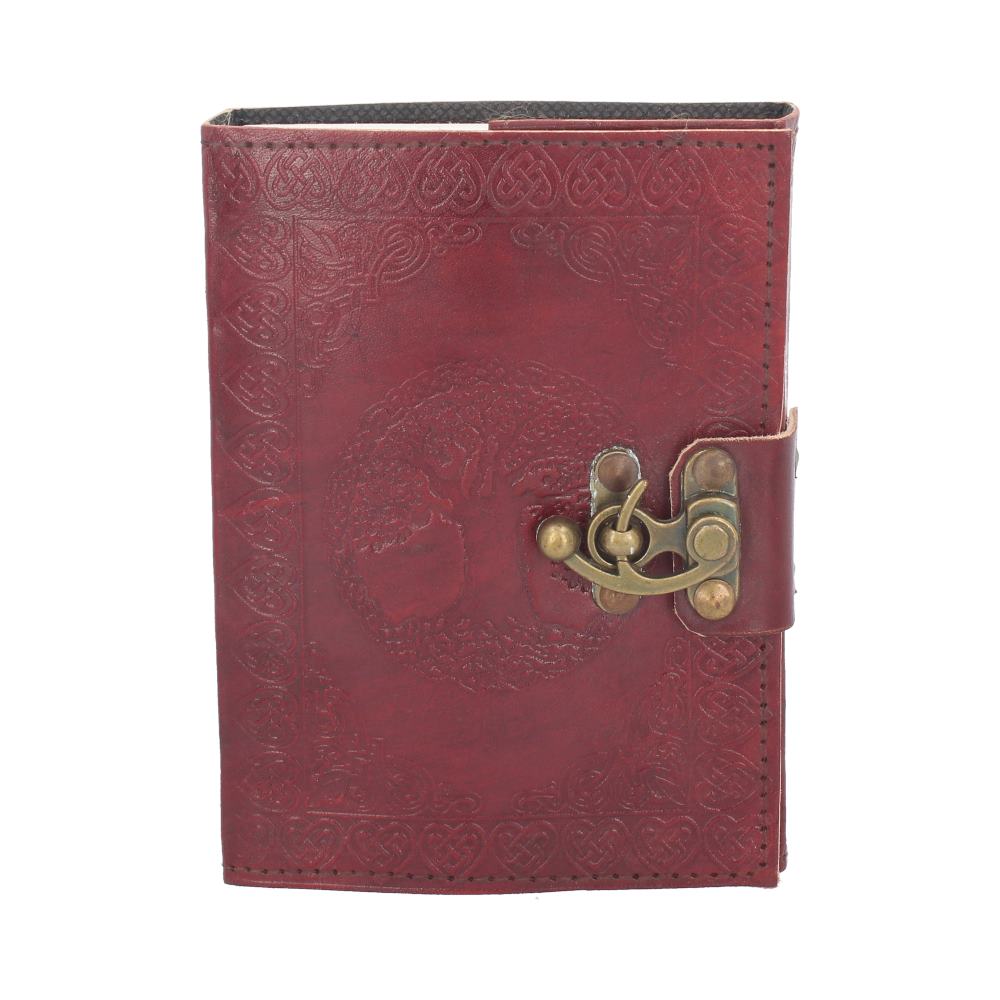 A red leather journal with a tree embossed on the cover, secured by a brass latch, sits against a plain white background.