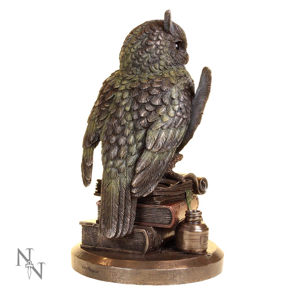 An intricately detailed owl statue perches on a stack of books. It is surrounded by an inkwell and quill, on a rounded metallic base.