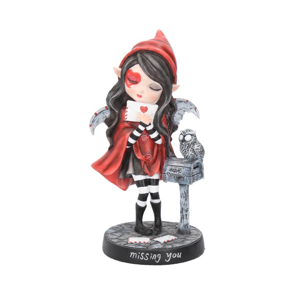 A figurine of a girl with elf ears and a red hood reads a letter beside an owl on a mailbox. The base reads "missing you" and has scattered letters.