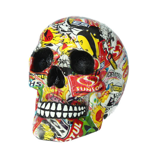 A colorful skull adorned with various stickers and logos such as "SUNSOIL," "MOTUL," and "IDEMITSU," set against a white background, showcasing a vibrant, artistic theme.