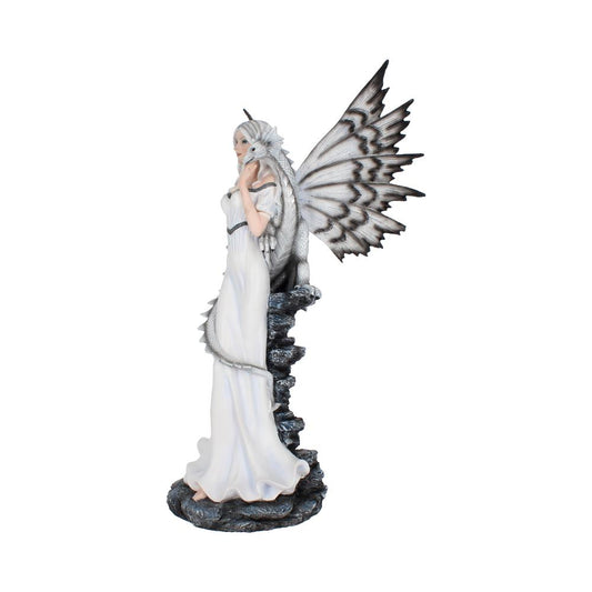 A figurine of a woman with butterfly wings stands on a rocky base, draped in a white gown, with a dragon wrapped around her, set against a plain background.