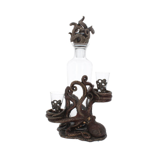 A glass decanter and two shot glasses sit on an octopus-shaped stand, with the decanter's stopper shaped like octopus tentacles, all against a white background.
