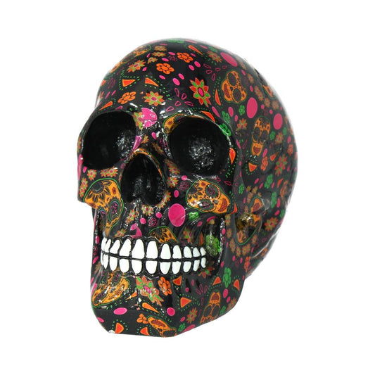 A decorative skull adorned with vibrant, colorful patterns of flowers and abstract shapes, displayed against a white background, emphasizing its intricate, festive design.