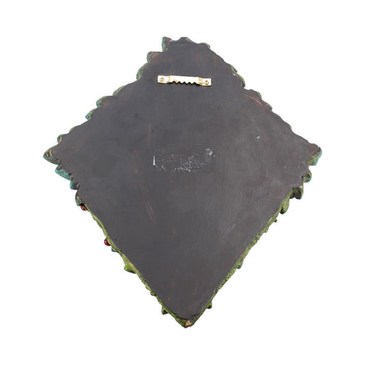 Wooden plaque with a sawtooth hanger, designed for wall mounting, has a scalloped edge and dark surface, surrounded by a plain white background.