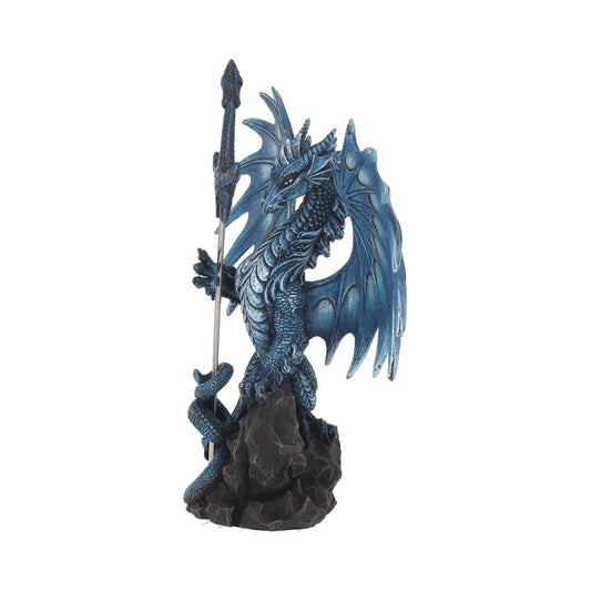 A blue dragon figurine holds a dagger, perched atop a dark rock. The figurine is isolated against a white background.