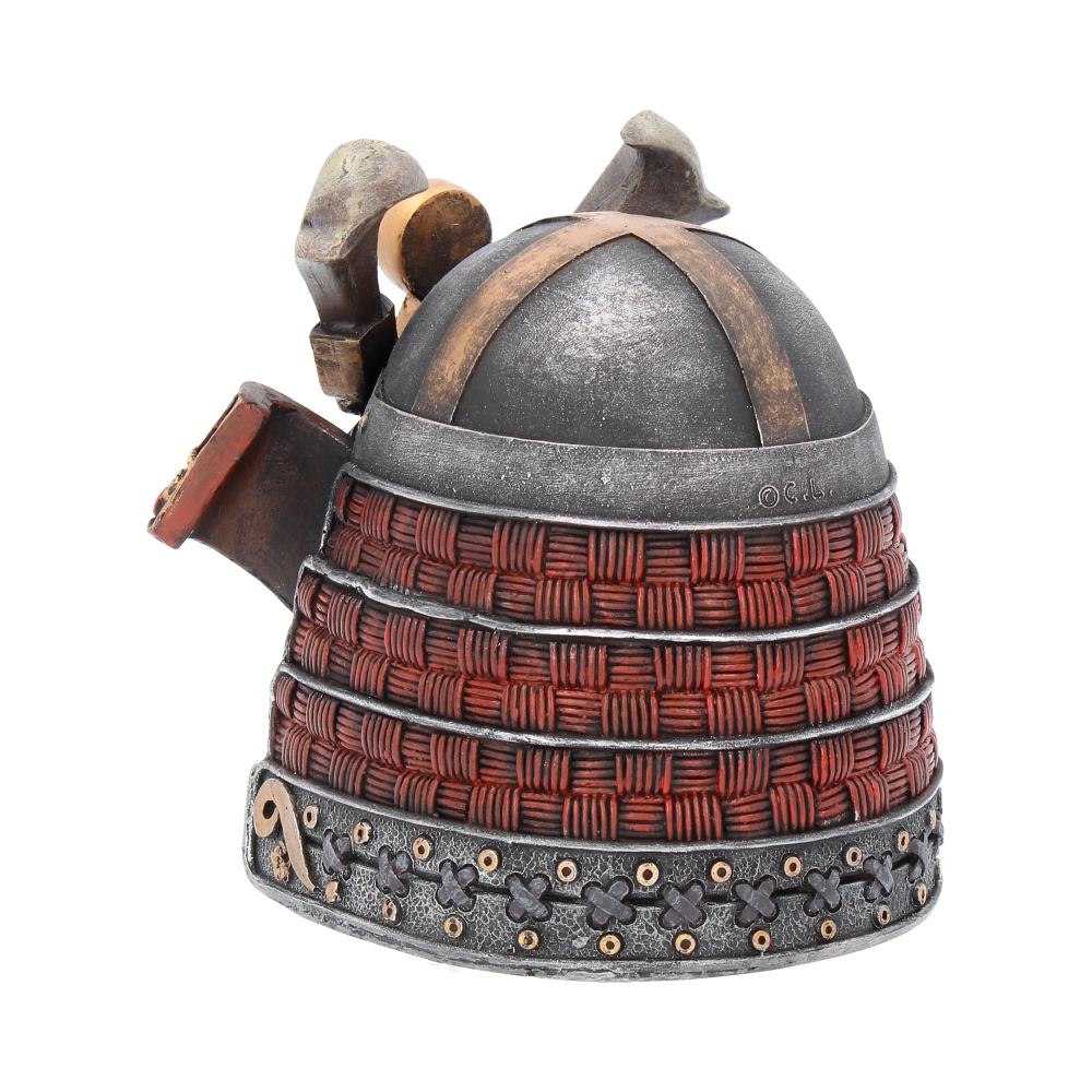 Samurai-style decorative helmet featuring a textured metal dome with brown accents, red weaving, and intricate black and gold detailing at the base. Background is plain white.