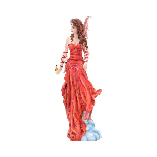 A fairy figurine in a flowing red dress holds a butterfly, standing on clouds. Her long hair cascades over her shoulders, and delicate wings extend from her back.