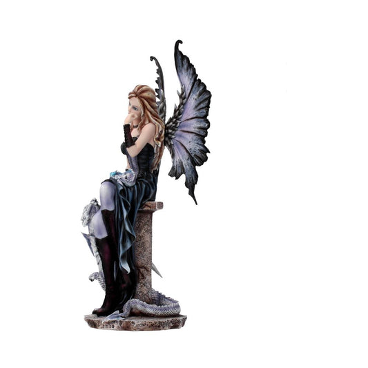 Fairy figurine with large, intricate wings, sits pensively on a stone pedestal. She wears a dark dress and knee-high boots, with a serpent coiled at the base. Background is plain white.