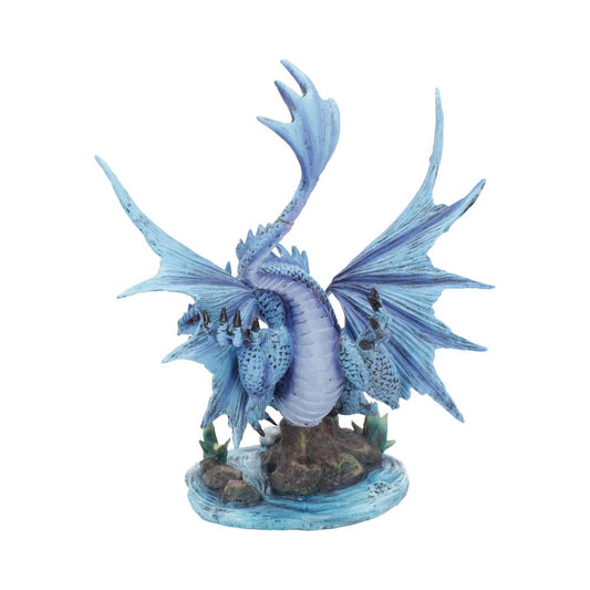 A detailed, blue figurine of a dragon stands with wings spread on a rocky base, surrounded by water and small green plants, showcasing its intricate scales and spikes.
