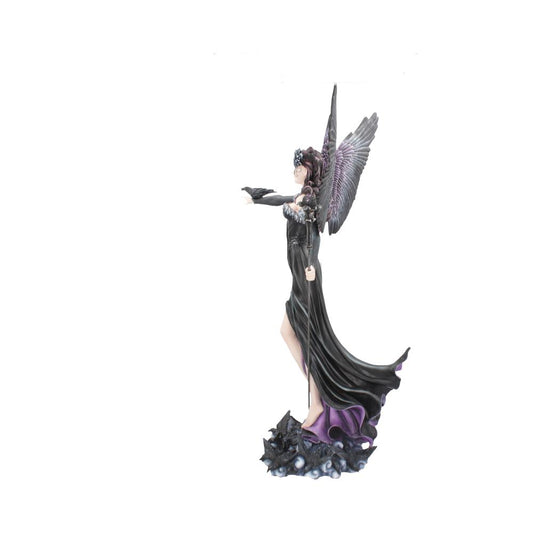 A winged fairy figurine stands tall holding a staff, with a crow perched on her extended left arm. She stands on a dark, rocky base with purple accents, against a white background.