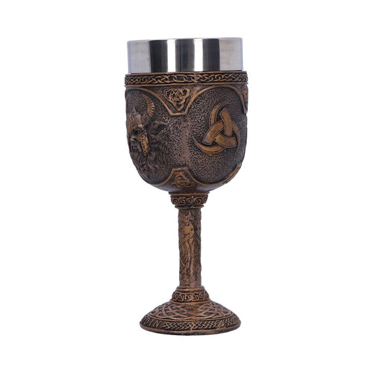 A decorative goblet, bronze with Celtic designs and a stainless-steel interior, sits upright. The background is plain white.