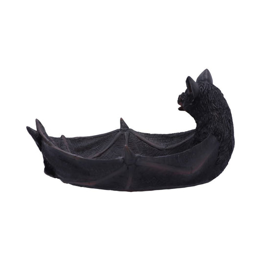 A black bat-shaped bowl with detailed wings forms an open container. Its head is slightly raised, providing a gothic, decorative centerpiece. The background is plain white.