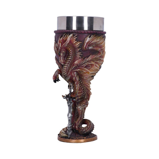 A decorative goblet stands on a white surface, featuring a dragon wrapped around a sword, with a stainless-steel cup inset at the top.