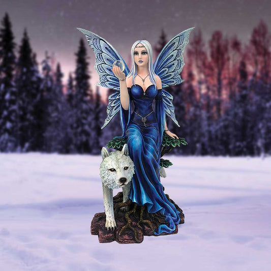 A winged fairy wearing a blue gown sits on a tree stump while holding a clear orb, as a white wolf stands guard at the base, set in a snowy forest.