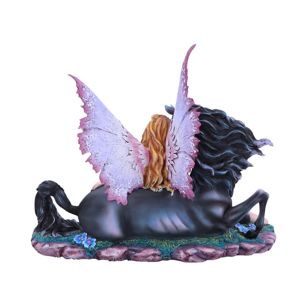 A winged fairy rests on the back of a black horse lying prone on a rocky base. The fairy has long, blonde hair and lavender wings.