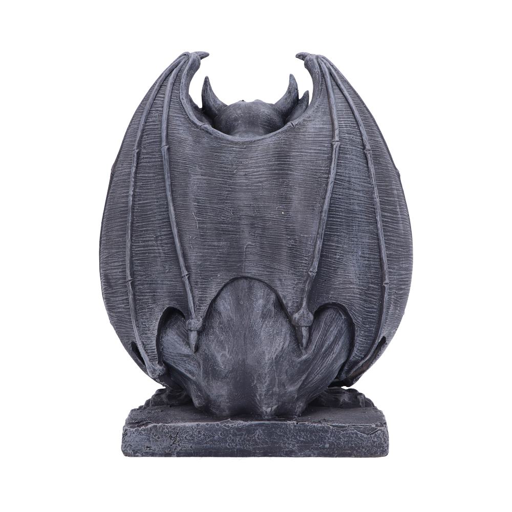 Stone gargoyle, seen from behind, perched on a stone base with its bat wings spread wide, isolated against a white background.
