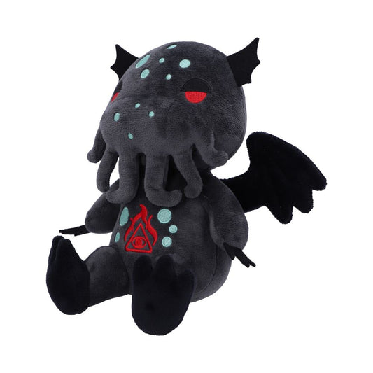 A dark plush Cthulhu doll sits with legs extended in a bright white space. The doll has wings, a tentacled face, and an eye-in-triangle symbol.