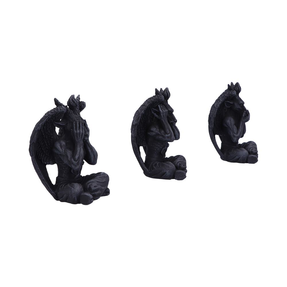 Three dark gargoyle statues, with wings and horns, sit in a row: one covers its eyes, one its ears, and one its mouth. They are on a white background.