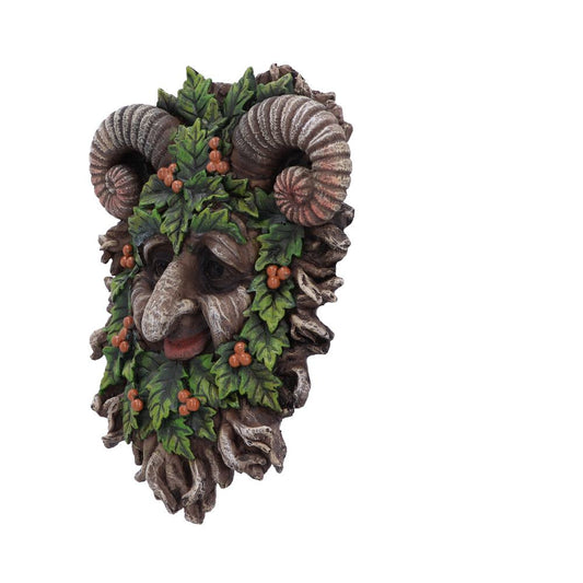 A decorative mask depicts a mythical face with prominent ram horns, surrounded by green leaves and orange berries, set against a plain white background.