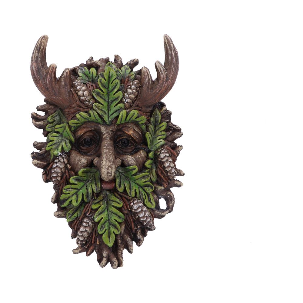 A sculpted mask with a face of leaves and pinecones. It features horns, leaf-beard, and detailed facial features, set against a plain white background.