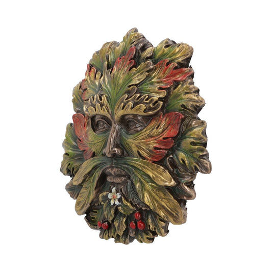 Decorative mask resembling a face, featuring intricately carved green and red leaves as facial features, set against a plain white background.