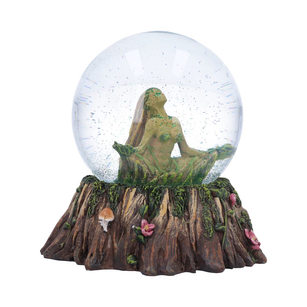 A tree nymph figurine sits peacefully inside a glass sphere, which rests on a sculpted tree stump base.  The scene includes small mushrooms and flowers.